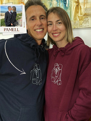 Couple wearing custom embroidered hoodies showcasing a unique design, perfect for cherished memories and heartfelt gifts.