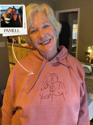 Custom embroidered hoodies featuring a heartfelt design, perfect for capturing memories.